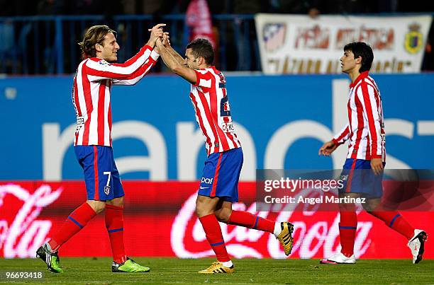 Simao Sabrosa of Atletico Madrid celebrates with his team mate Diego Forlan after scoring during the La Liga match between Atletico Madrid and...