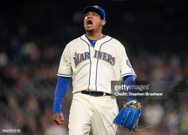 Starting pitcher reacts Felix Hernandez of the Seattle Mariners after getting out of bases-loaded jam during the fifth inning of a game against the...