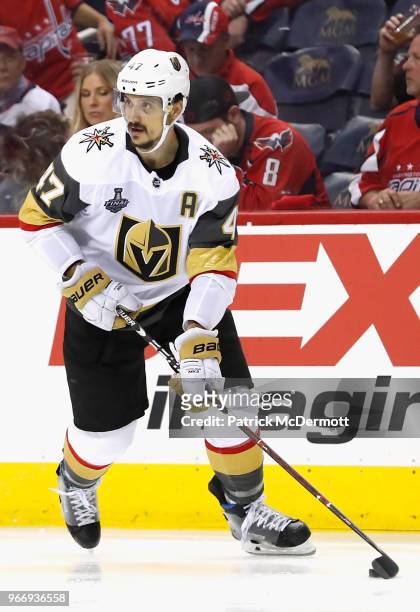 Luca Sbisa of the Vegas Golden Knights handles the puck during Game Three of the 2018 NHL Stanley Cup Final against the Washington Capitals at...