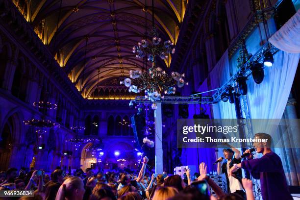 Roman Lochmann and Heiko Lochmann of the German band 'Die Lochis' perform on stage after 'Youth engagement in the fight to end AIDS' panel talk with...