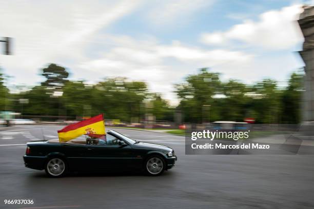 Spanish flag waiving in a car after a protest against Pedro Sanchez's Government and demanding general elections in Spain, following the motion of...