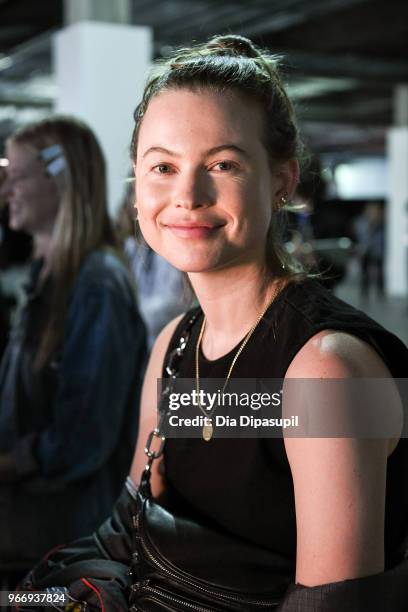 Behati Prinsloo prepares backstage at the Alexander Wang June 2018 fashion show at Pier 17 on June 3, 2018 in New York City.