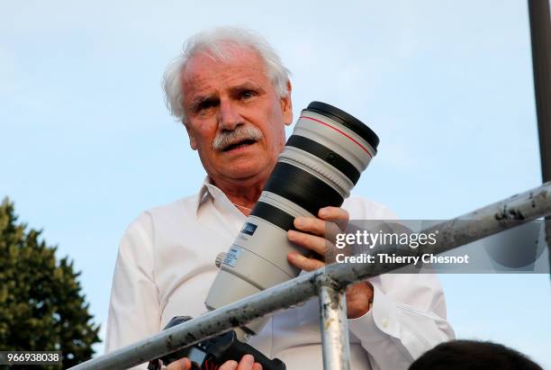 French photographer Yann Arthus-Bertrand is seen during the 30th edition of the "Diner En Blanc" event on the Invalides esplanade on June 3, 2018 in...