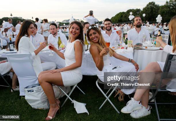 People dressed in white gather for the 30th edition of the "Diner En Blanc" event on the Invalides esplanade on June 3, 2018 in Paris, France. The...