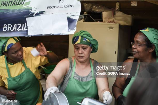 Brazilian female chefs seen cooking traditional Brazilian food at the festival in Athens about traditional Latin-American culture with food, drinks,...