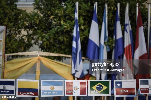 Latin American countries flags seen at the festival. Festival in Athens about traditional Latin-American culture with food, drinks, Latin dances,...