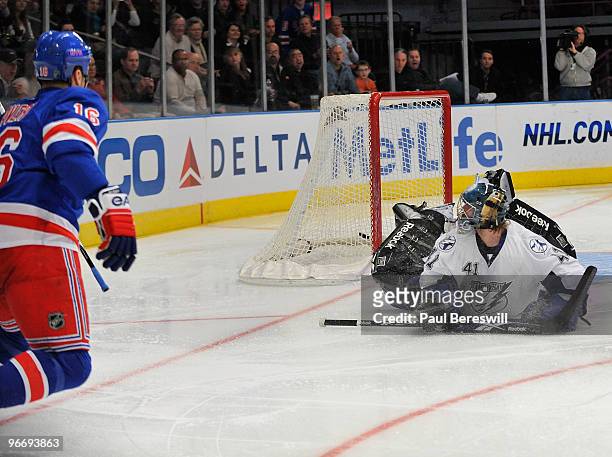 Sean Avery of the New York Rangers watches his shot go in the net past goalie Mike Smith of the Tampa Bay Lightning as Avery scored on a penalty shot...