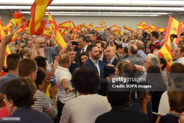 The National President of Vox Santiago Abascal greets his militants and supporters as they wave Spanish flags upon his arrival at the political...