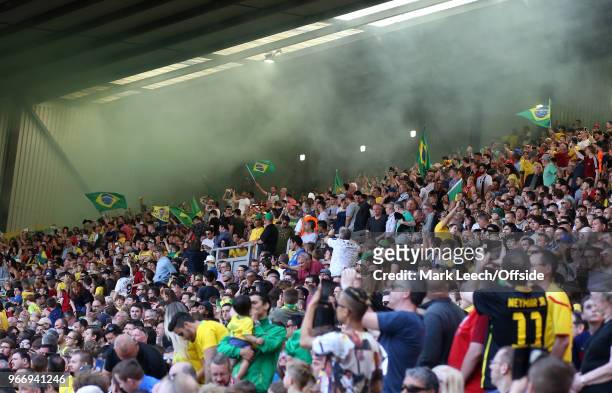 Brazilian supporters make smoke and wave national flags on The Kop during the friendly international football match between Brazil and Croatia at...