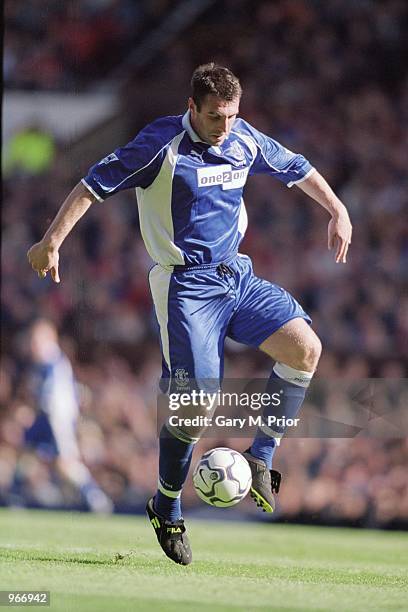 David Unsworth of Everton in action during the FA Barclaycard Premiership match against Manchester United played at Old Trafford in Manchester,...