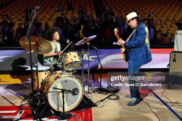 Carlos Santana and Cindy Blackman warm up before the game between the Cleveland Cavaliers and the Golden State Warriors in Game Two of the 2018 NBA...