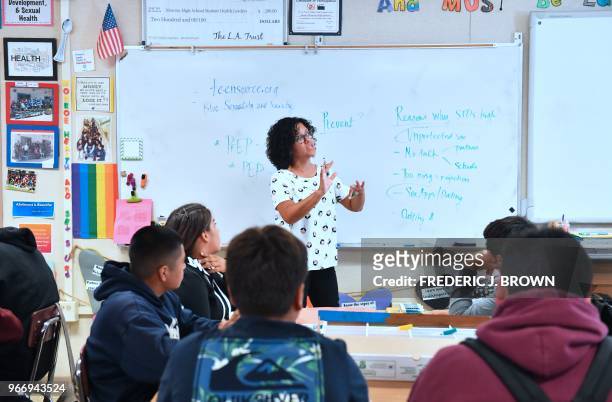 Health Education teacher Leticia Jenkins speaks to her class of ninth graders at James Monroe High School in North Hills, California on May 18 where...