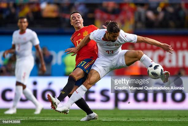 Iago Aspas of Spain competes for the ball with Ricardo Rodriguez of Switzerland during the International Friendly match between Spain and Switzerland...