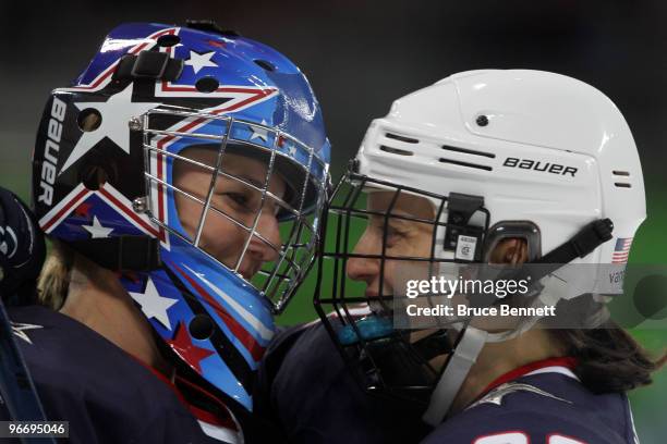 Brianne Mclaughlin and Kerry Weiland of the United States celebrate after defeating China during their women's ice hockey preliminary game at UBC...