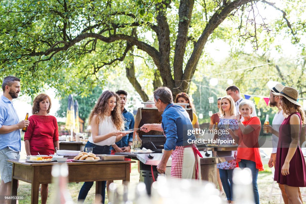 Family celebration or a barbecue party outside in the backyard.