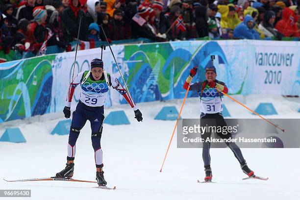 Tim Burke of United States and Michael Greis of Germany competes in the men's biathlon 10 km sprint final on day 3 of the 2010 Winter Olympics at...
