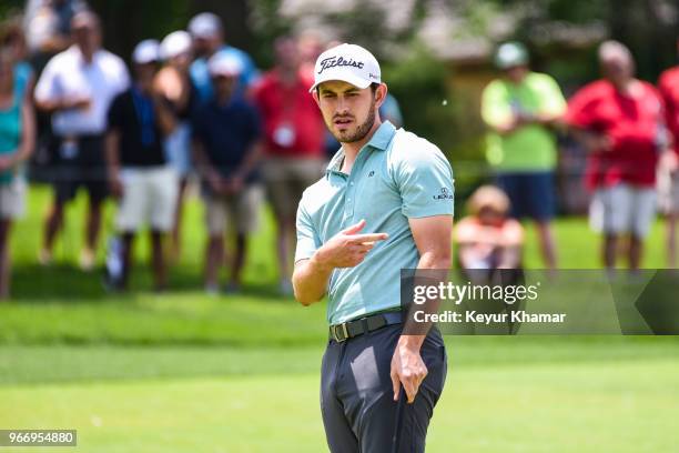 Patrick Cantlay reacts to his putt on the 13th hole green during the final round of the Memorial Tournament presented by Nationwide at Muirfield...