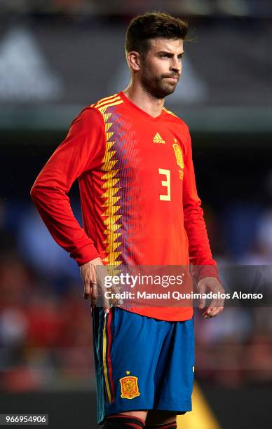 Gerard Pique of Spain looks on during the International Friendly match between Spain and Switzerland at Estadio de La Ceramica on June 3, 2018 in...