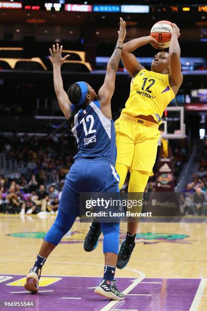 Chelsea Gray of the Los Angeles Sparks shoots against Alexis Jones of the Minnesota Lynx during a WNBA basketball game at Staples Center on June 3,...