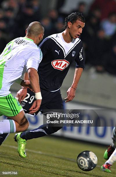 Bordeaux's forward Marouane Chamakh fights for the ball with Saint-Etienne's defender Yohan Benalouane during their French L1 football match, on...