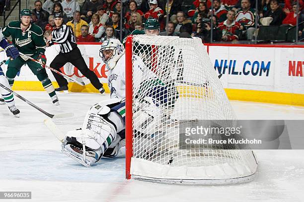 Andrew Brunette of the Minnesota Wild scores a goal against Roberto Luongo of the Vancouver Canucks during the game at the Xcel Energy Center on...