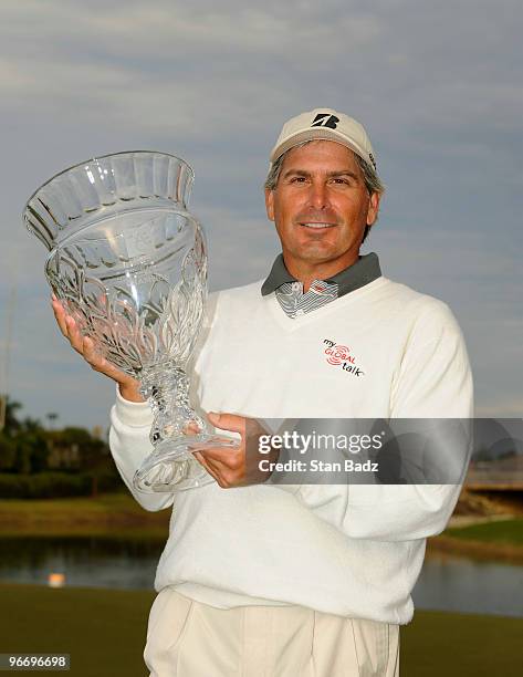 Fred Couples holds the winner's trophy after the final round of The ACE Group Classic at The Quarry on February 14, 2010 in Naples, Florida. This was...