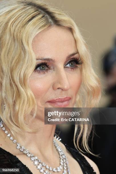 Madonna and Sharon Stone Madonna on the Red Carpet in Cannes to promote 'I Am Because We Are'. Madonna wears Chopard jewels.
