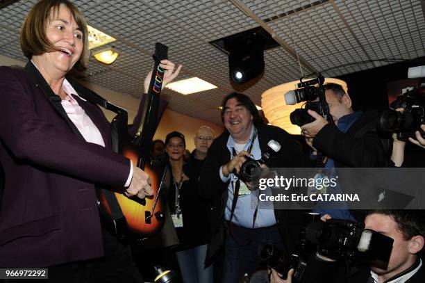 French Minister of Culture Christine Albanel Launches the 43rd edition of the Midem Music Market and testes her virtuosity at the 'Guitar Hero' game.