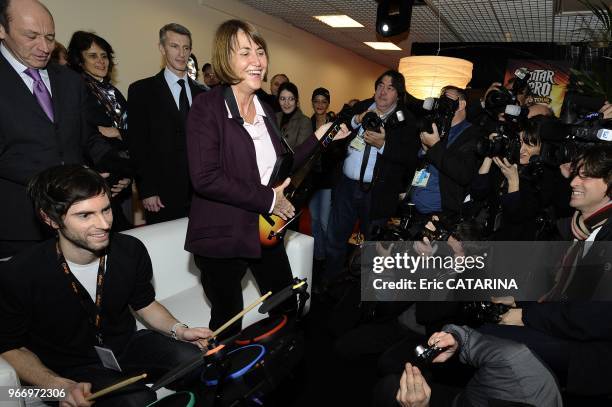 French Minister of Culture Christine Albanel Launches the 43rd edition of the Midem Music Market and testes her virtuosity at the 'Guitar Hero' game.