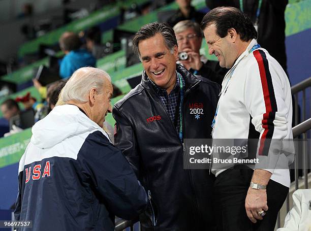 United States vice-president Joe Biden talks with former govenor Mitt Romeny and Mike Eruzione attend women's ice hockey preliminary game between...