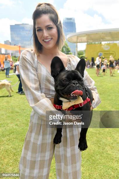 Country music star Cassadee Pope celebrates the role that dogs play in making our lives better at the Paws & Play Music Festival, hosted by the...