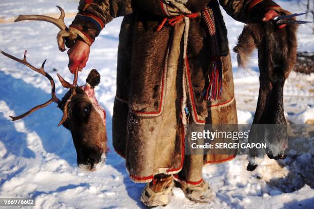 Reindeer herder poses in the remote Yamalo-Nenets region of northern Russia on March 8, 2018.