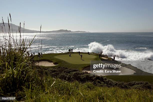 Dustin Johnson putts on the seventh hole during the final round of the AT&T Pebble Beach National Pro-Am at Pebble Beach Golf Links on February 14,...