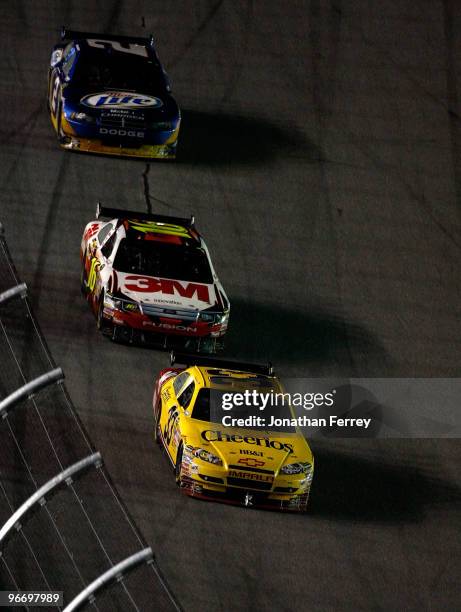 Clint Boyer in his Cheerios Chevrolet leads Greg Bifle in his 3M Ford during the NASCAR Sprint Cup Series Daytona 500 at Daytona International...