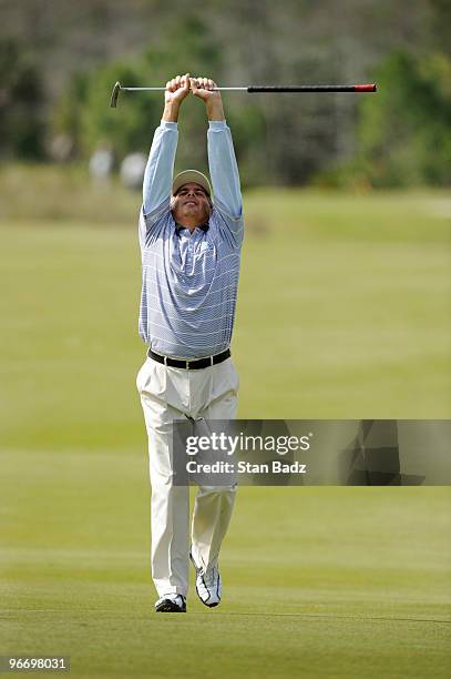 Fred Couples walks down the fifth fairway flexing his back during the final round of The ACE Group Classic at The Quarry on February 14, 2010 in...