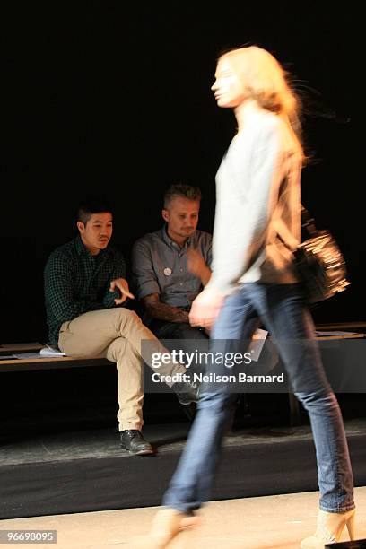 Designer Thakoon and guests watch as a model walks the runway at the Thakoon Fall 2010 Fashion Show during Mercedes-Benz Fashion Week at Eyebeam...