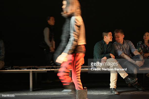 Designer Thakoon and guests watch as a model walks the runway at the Thakoon Fall 2010 Fashion Show during Mercedes-Benz Fashion Week at Eyebeam...