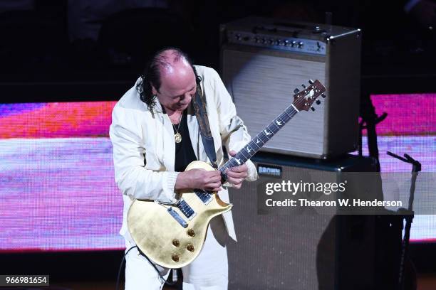 Carlos Santana performs the national anthem prior to Game 2 of the 2018 NBA Finals between the Golden State Warriors and the Cleveland Cavaliers at...