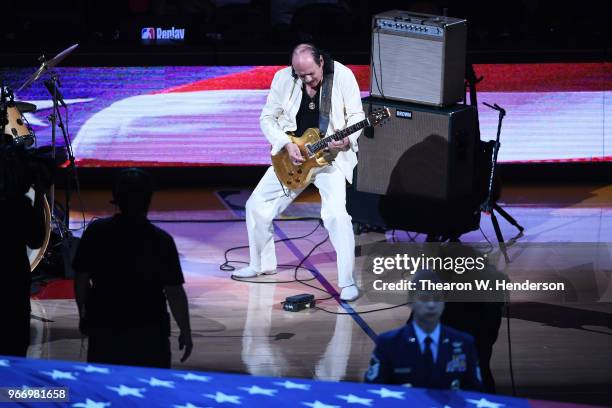 Carlos Santana performs the national anthem prior to Game 2 of the 2018 NBA Finals between the Golden State Warriors and the Cleveland Cavaliers at...