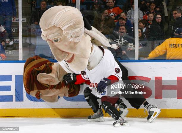 The Washington Nationals' Mascots get tangled up during the annual Presidents Day Race prior to the game between the Ottawa Senators and the New York...