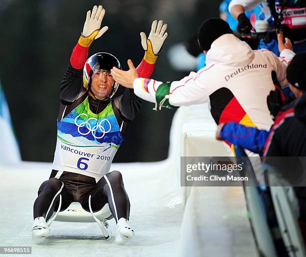 David Moeller of Germany celebrates after finishing the final run of the men's luge singles final on day 3 of the 2010 Winter Olympics at Whistler...