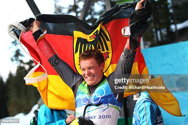 Felix Loch of Germany celebrates winning the gold medal after the final run of the men's luge singles final on day 3 of the 2010 Winter Olympics at...