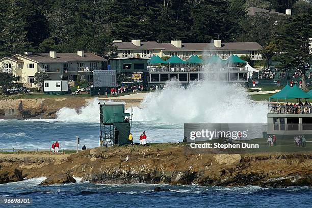 Waves crash along the 18th hole in a view over the 17th green during the final round of the AT&T Pebble Beach National Pro-Am at Pebble Beach Golf...