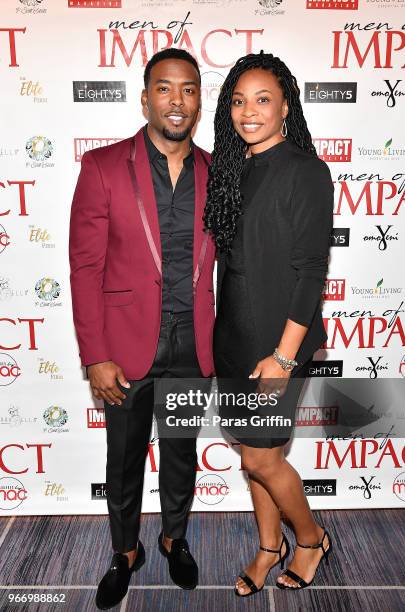 Retired NFL Player Andrew Hawkins with wife attend Men of Impact Honoree Dinner at Four Seasons Hotel on June 3, 2018 in Atlanta, Georgia.