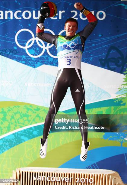 Felix Loch of Germany celebrates winning the gold medal after the final run of the men's luge singles final on day 3 of the 2010 Winter Olympics at...