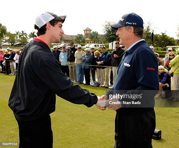 Honorary Observer, Ian Bellah, left, is greeted by Jay Haas, right, on the first tee box during the final round of The ACE Group Classic at The...