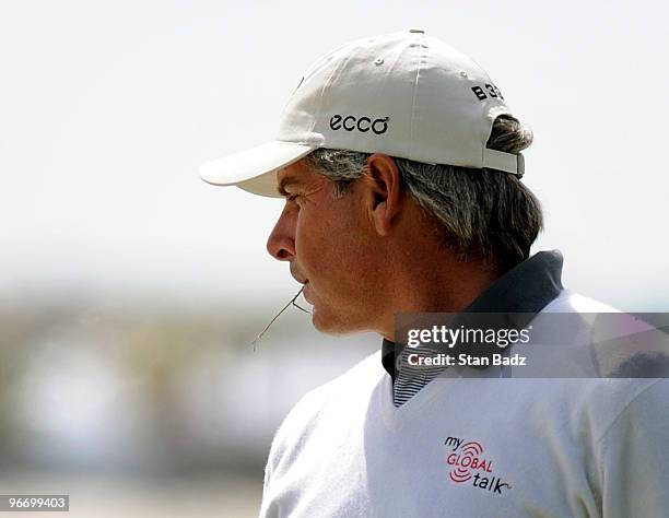 Fred Couples waits for play crewing on a blade of grass during the final round of The ACE Group Classic at The Quarry on February 14, 2010 in Naples,...