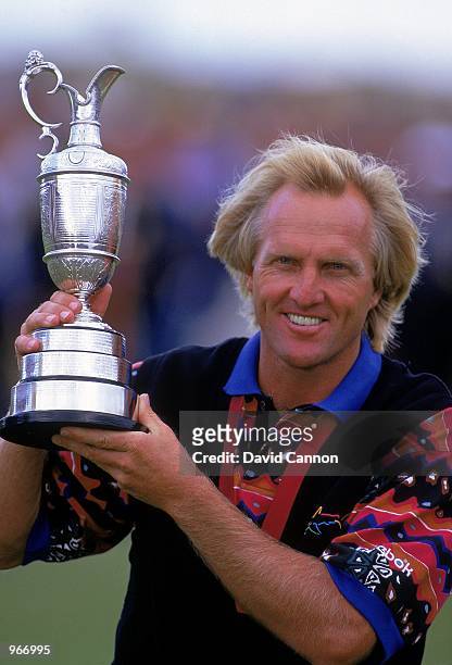 Greg Norman of Australia holds aloft the Claret Jug after winning the British Open played at Royal St George's in Sandwich, Kent, England. \...