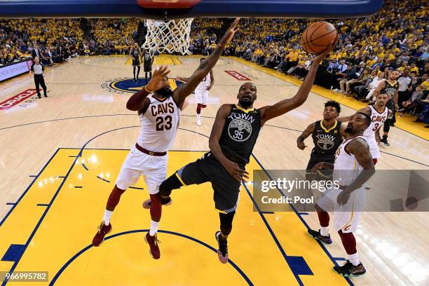 Kevin Durant of the Golden State Warriors attempts a layup over LeBron James of the Cleveland Cavaliers during the second quarter in Game 2 of the...