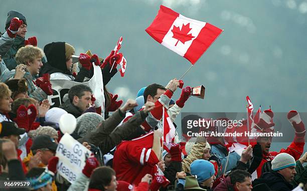 Fans supporting Canada cheer during the finals of the Men's Singles Luge on day 3 of the 2010 Winter Olympics at Whistler Sliding Centre on February...